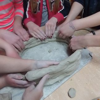 hands in clay